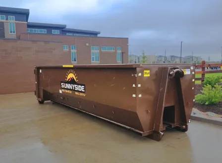 Sunnyside roll-off container shown to help answer what size dumpster do I need